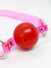 Кляп неоновий DS Fetish, рожевий ремінець з червоною кулькою - картинка 1
