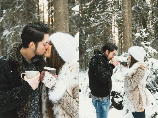 Парень отогревает и целует девушке руки в лесу зимой - картинка